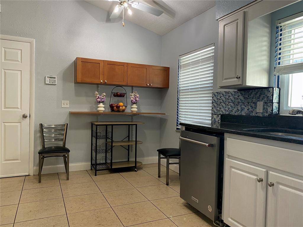 1020 Vernon Loop Oviedo, FL 32765 - Photo 10 of 34 a kitchen with a cabinets and chairs