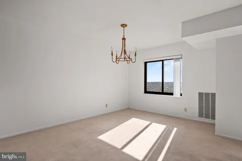 a kitchen with stainless steel appliances granite countertop a stove microwave and sink