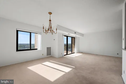 a kitchen with stainless steel appliances granite countertop a stove microwave and sink