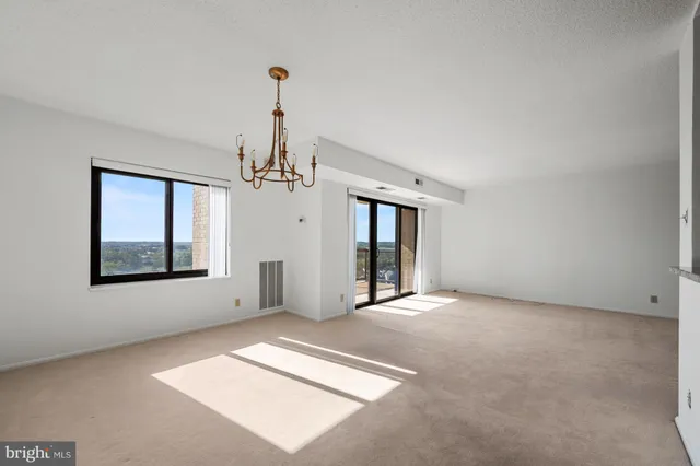 a kitchen with stainless steel appliances granite countertop a stove microwave and sink
