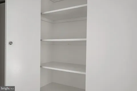 a view of a chairs and table in the balcony