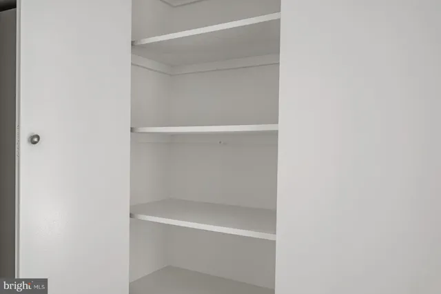 a view of a chairs and table in the balcony