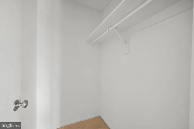 a view of swimming pool with outdoor seating and city view