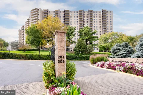 a view of swimming pool with outdoor seating and plants