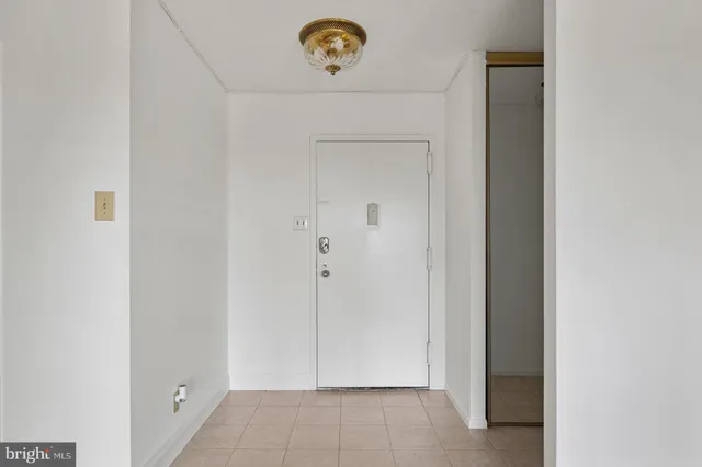 a view of an empty room with a window