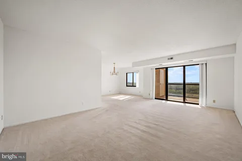 an empty room with a large window