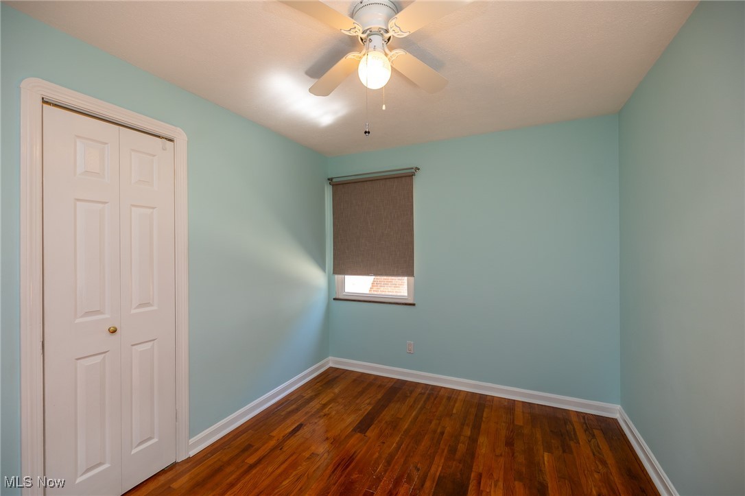 21475 Eaton Road Cleveland, OH 44126 - Photo 23 of 31 Empty room with ceiling fan and dark hardwood / wood-style flooring