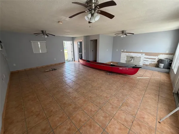 a view of livingroom with hardwood floor and cabinet