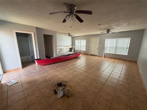 a very nice looking room with a large window and chandelier