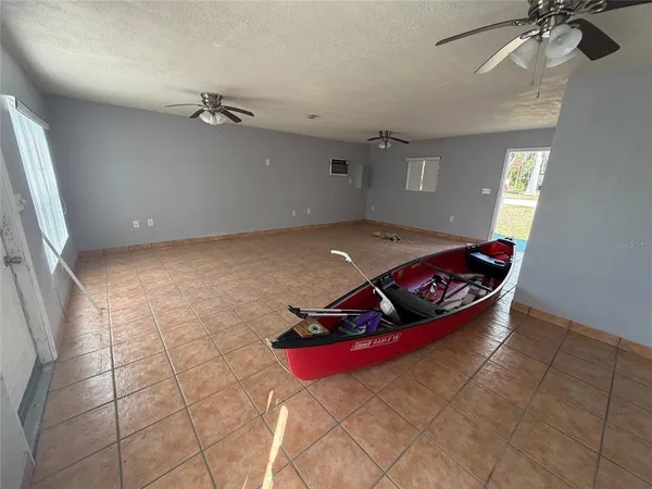 a room with gym equipment and a rug
