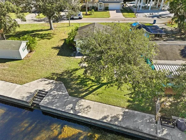 a view of swimming pool with a yard and sitting area