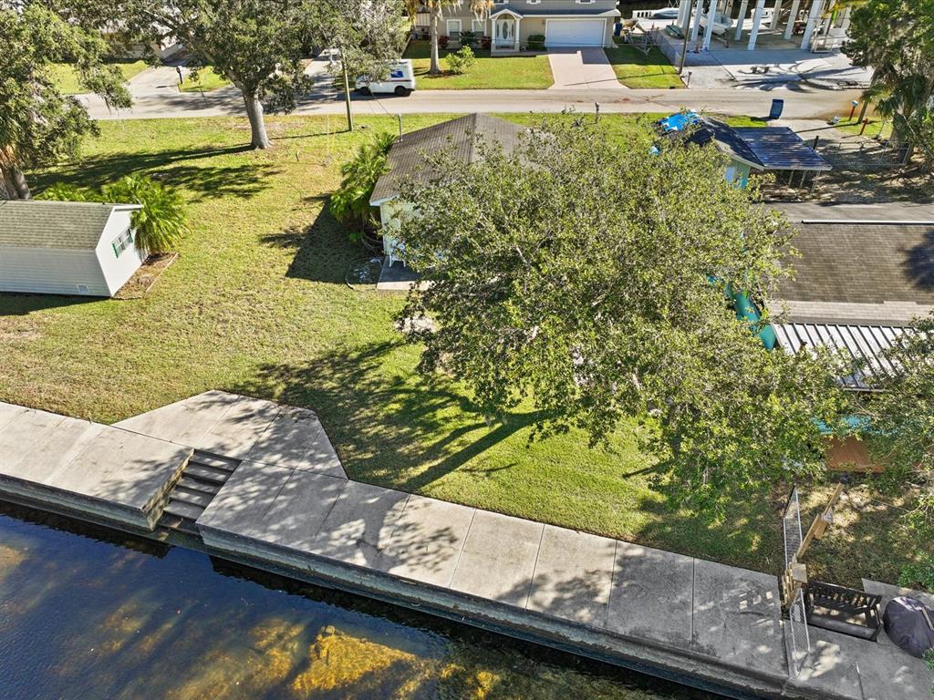 7255 Tropical Drive Weeki Wachee, FL 34607 - Photo 4 of 20 a view of swimming pool with a yard and sitting area