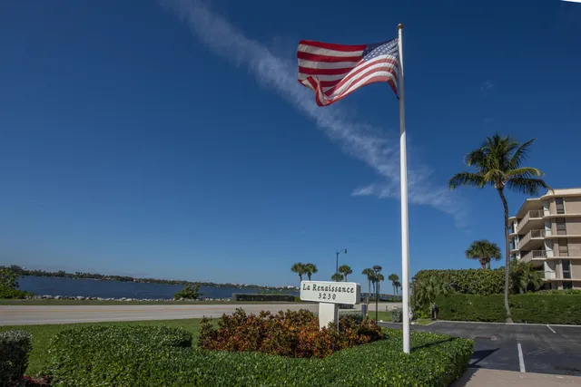 an aerial view of a house with garden space and street view