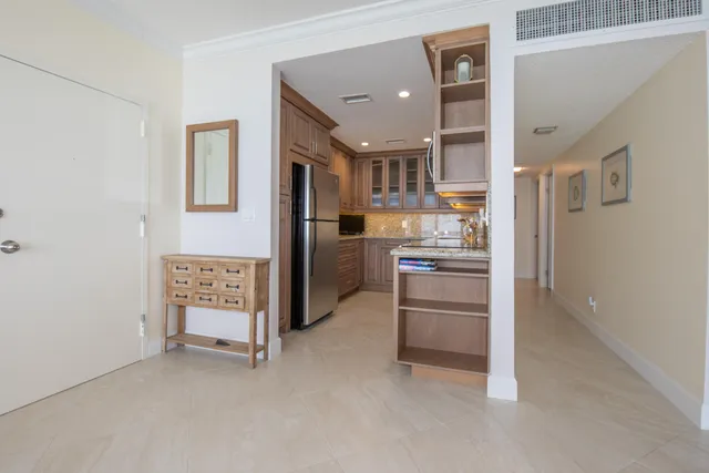 a kitchen with stainless steel appliances granite countertop cabinets and window