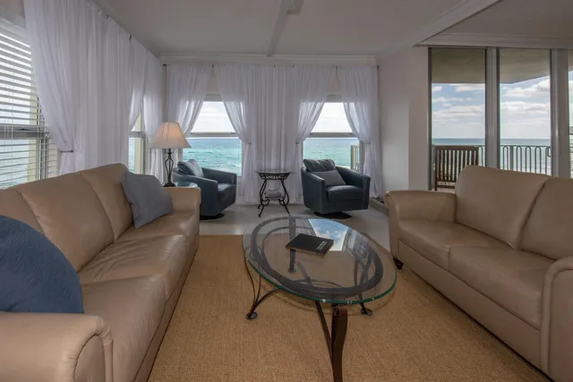 a bathroom with a shower a toilet and sink