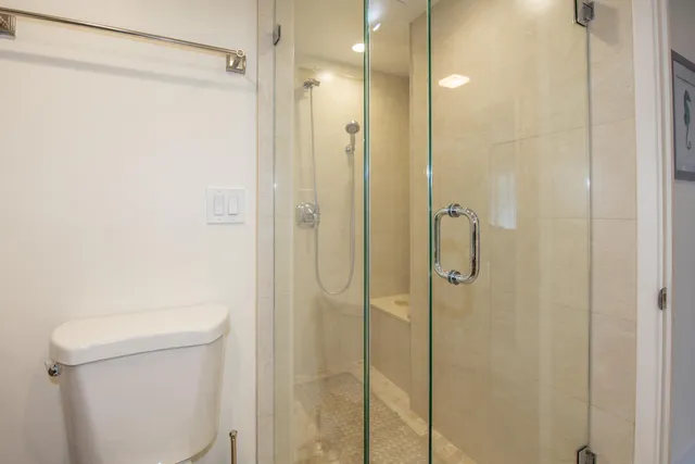a view of a bathroom with a glass door shower