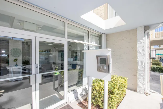 a view of a swimming pool and outdoor seating
