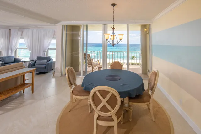 a view of a dining room with furniture window and outside view