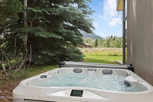 a view of jacuzzi and garden
