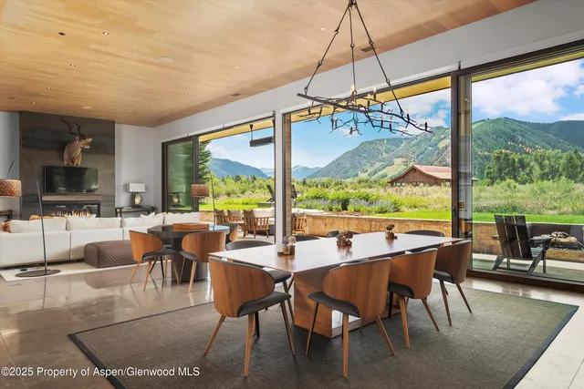 a view of a dining room with furniture window and outside view