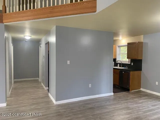 a view of a kitchen from the hallway
