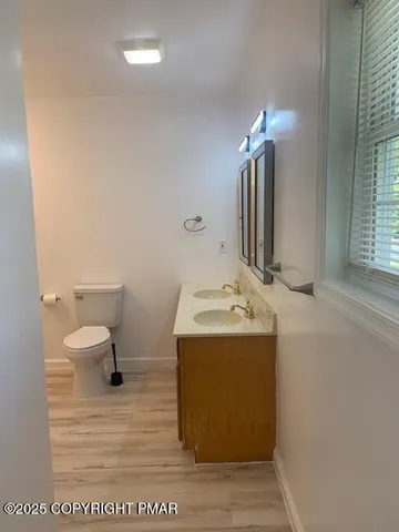a bathroom with a toilet and a bathtub