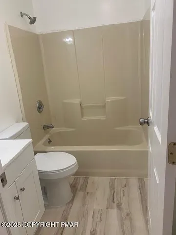a bathroom with a sink toilet and vanity