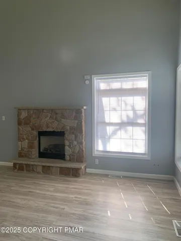 an empty room with a fireplace