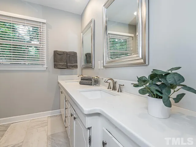 a bathroom with sink and mirror
