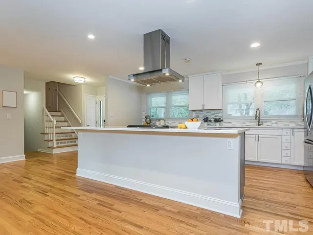 a view of kitchen with wooden floor