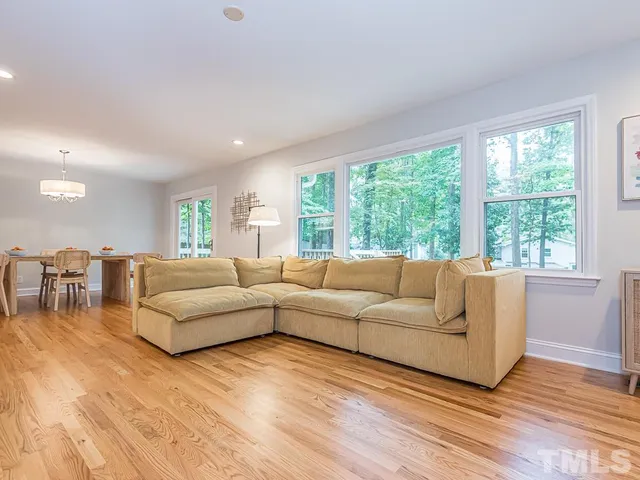 a bedroom with a bed dresser and a window