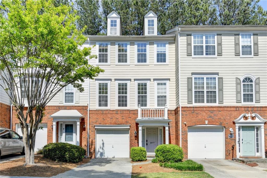 3977 Howell Park Road Duluth, GA 30096 - Photo 1 of 25 a front view of a building with balcony