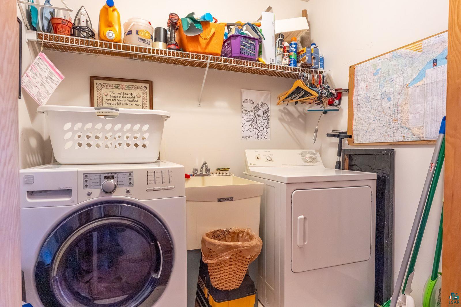 4452 Moccasin Point Road Tower, MN 55790 - Photo 21 of 44 Dedicated laundry area featuring a white front-load washing machine and a white dryer