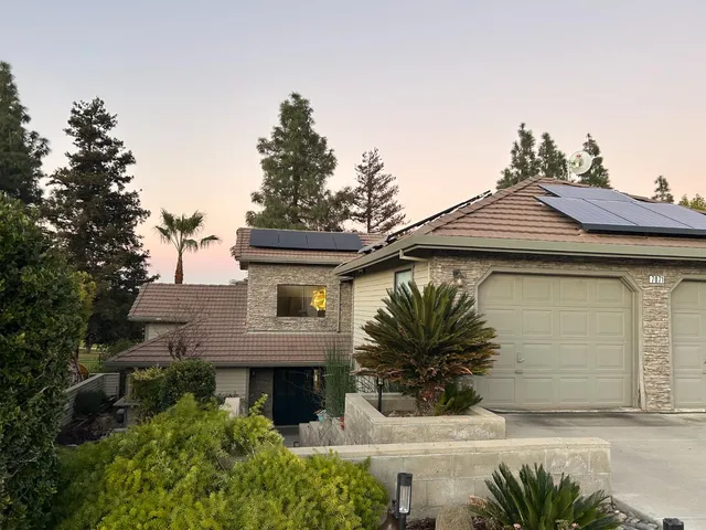a front view of a house with a garage
