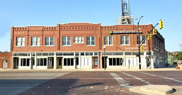 a front view of a building with a street