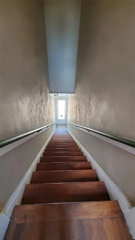 a view of front door with furniture and window
