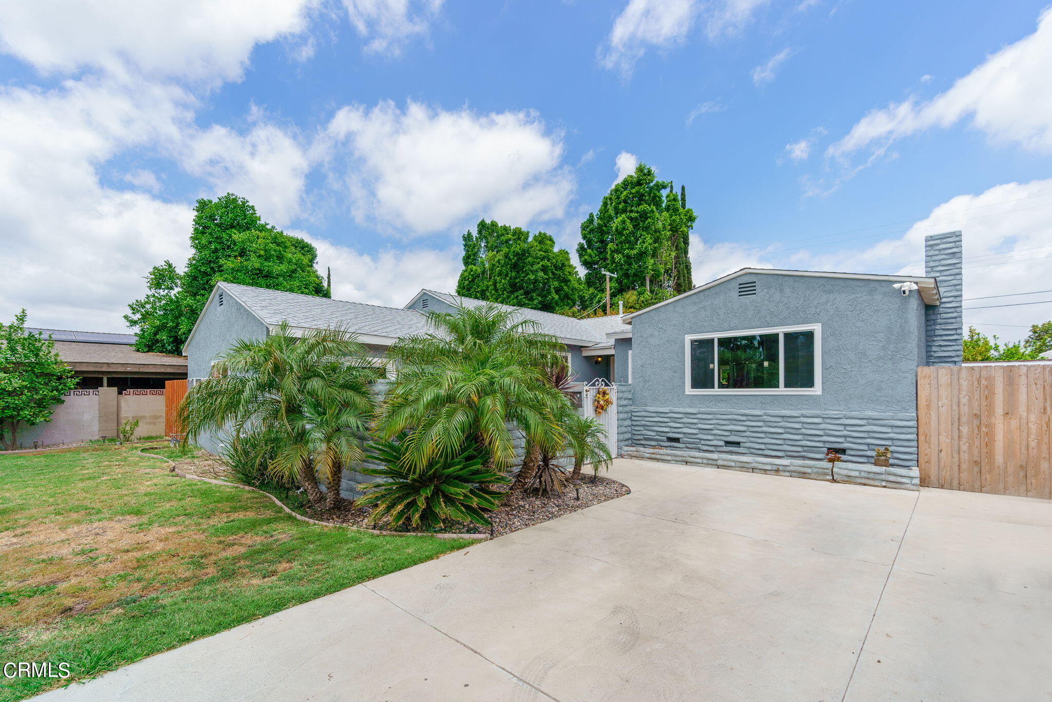 20205 Schoolcraft Street Winnetka, CA 91306 - Photo 1 of 22 a view of a house with a yard