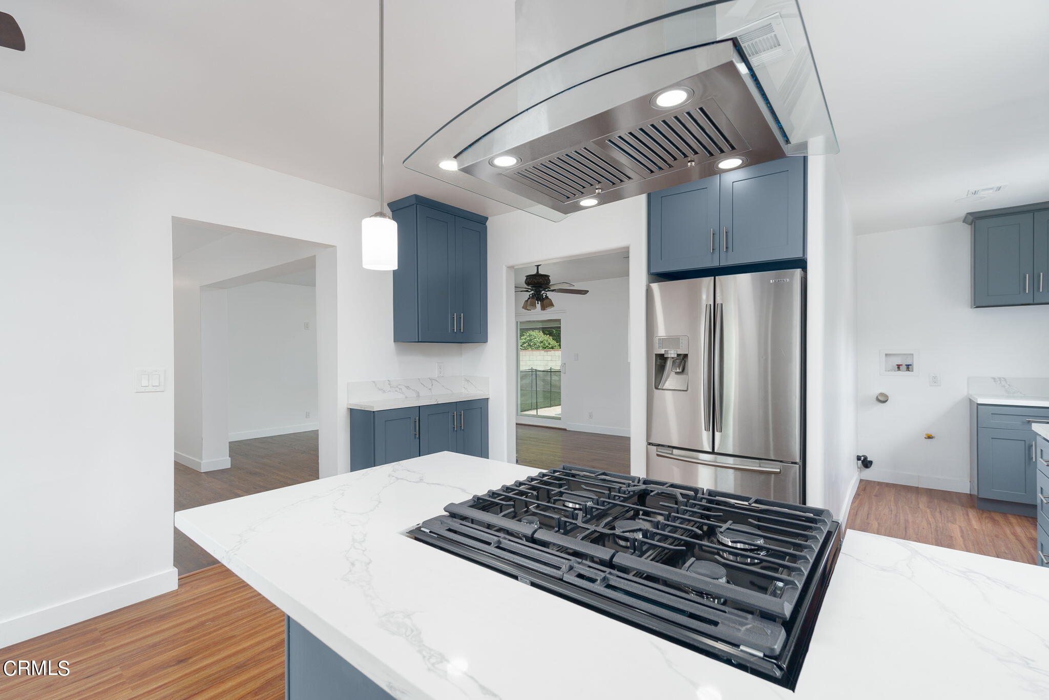 20205 Schoolcraft Street Winnetka, CA 91306 - Photo 7 of 22 a kitchen with stainless steel appliances granite countertop a sink stove and refrigerator