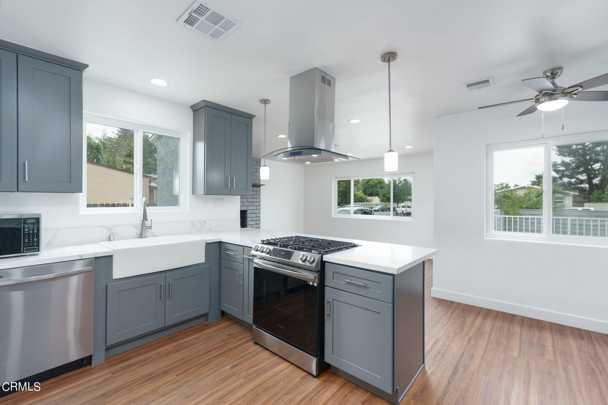 20205 Schoolcraft Street Winnetka, CA 91306 - Photo 10 of 22 a kitchen with stainless steel appliances granite countertop a sink stove and refrigerator