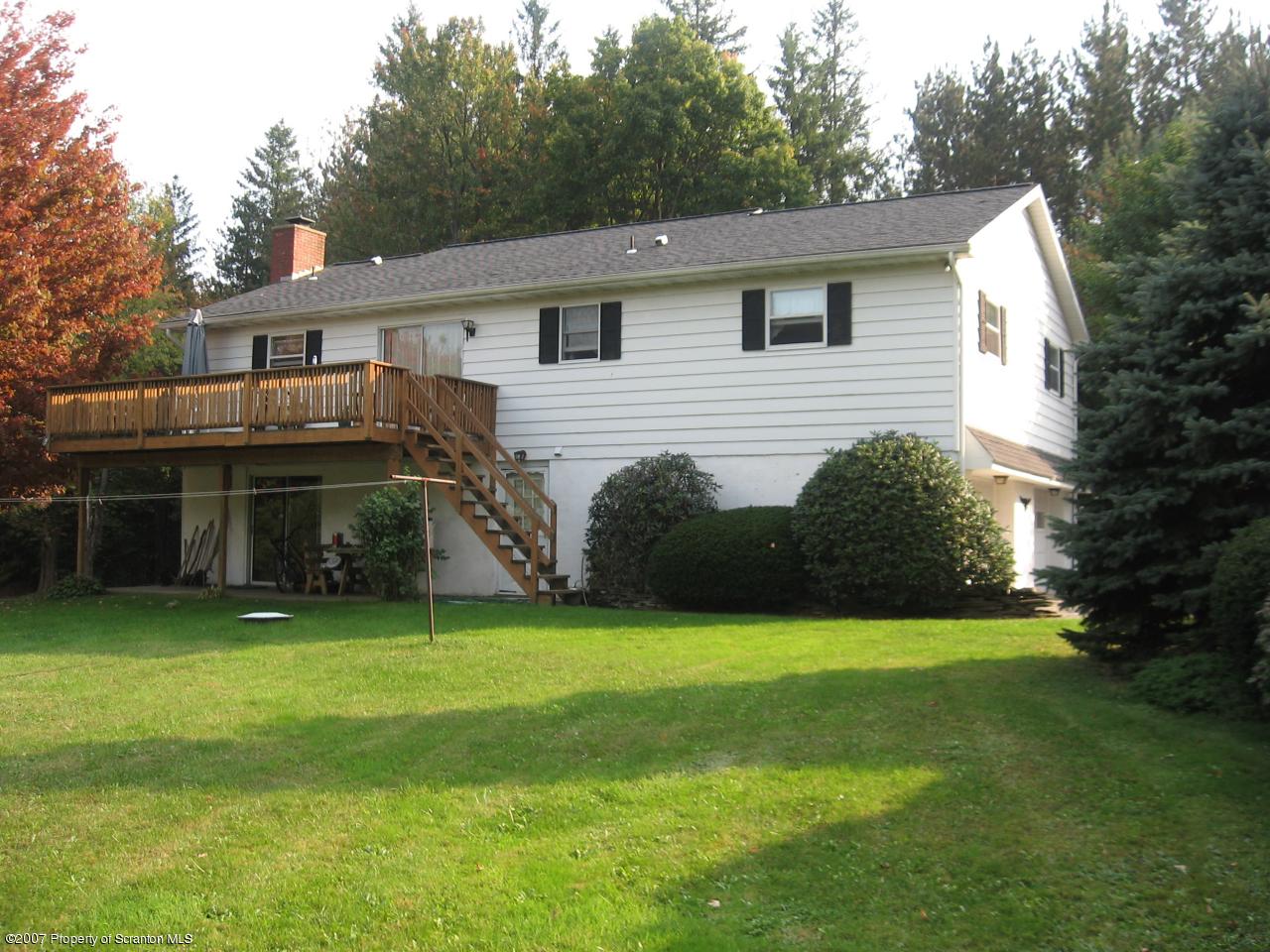 343 Fox And Hound Road Moscow, PA 18444 - Photo 3 of 4 a view of a house with a yard and sitting area