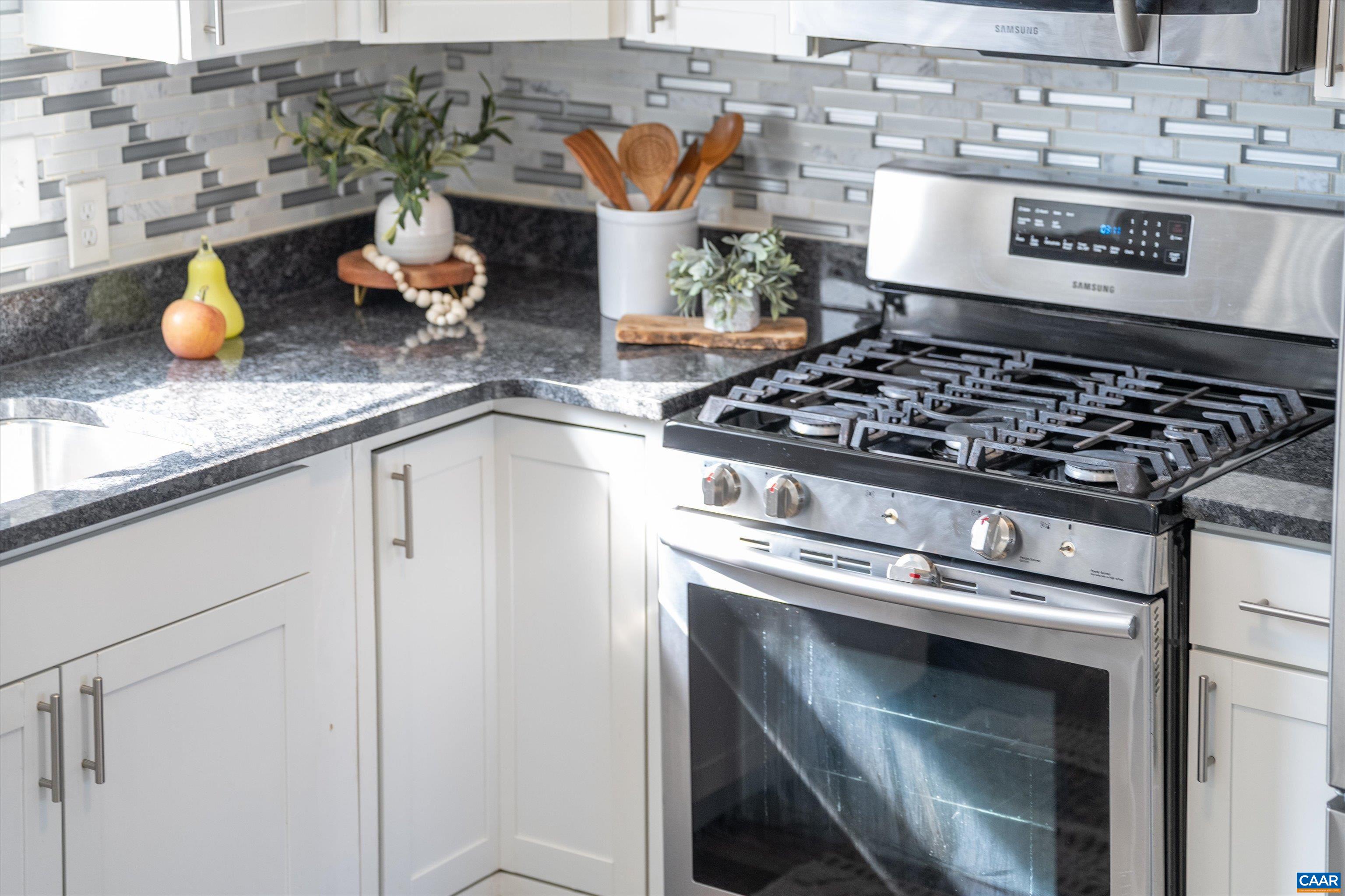 1424 B Street Waynesboro, VA 22980 - Photo 11 of 32 a stove top oven sitting inside of a kitchen