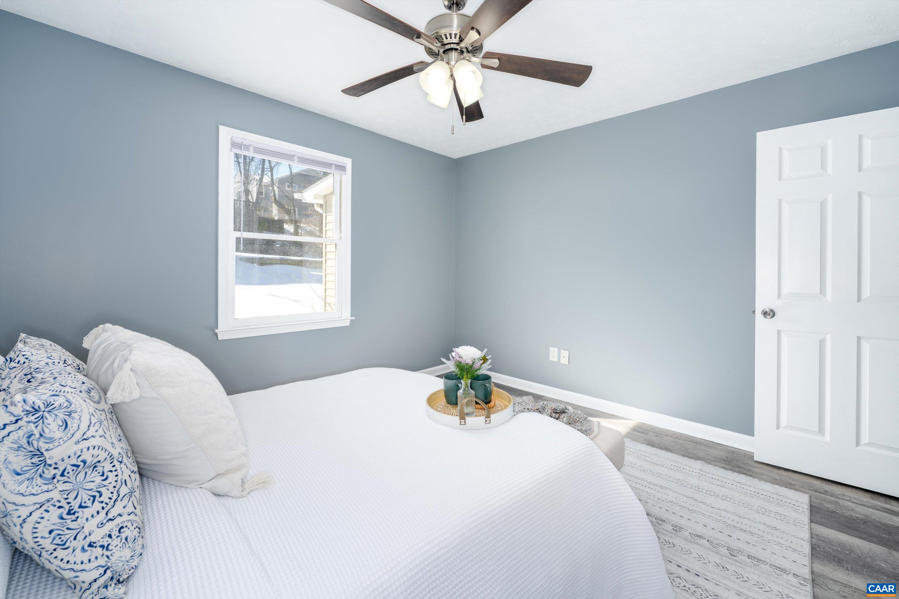 1424 B Street Waynesboro, VA 22980 - Photo 19 of 32 a bedroom with a bed and a chandelier