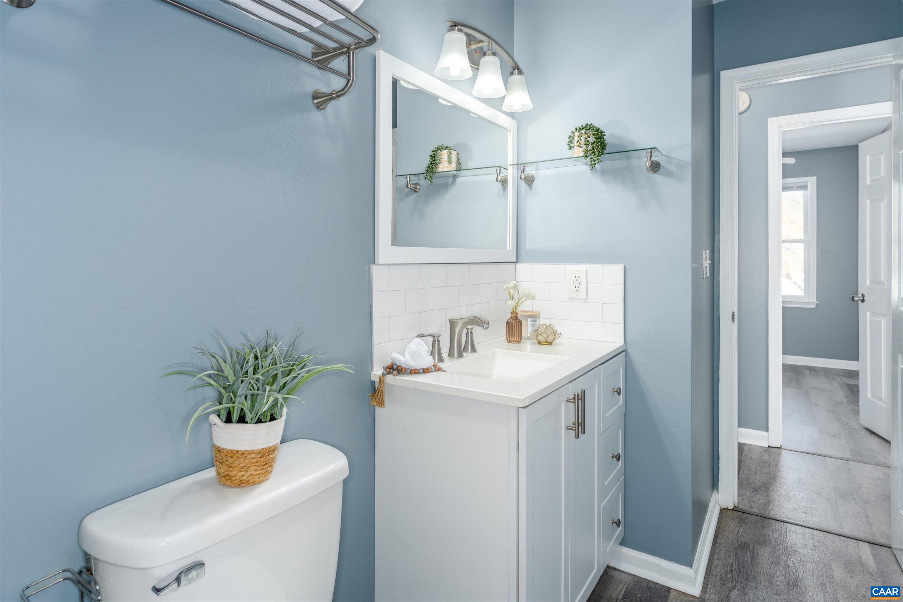 1424 B Street Waynesboro, VA 22980 - Photo 21 of 32 a bathroom with a sink a toilet and shower