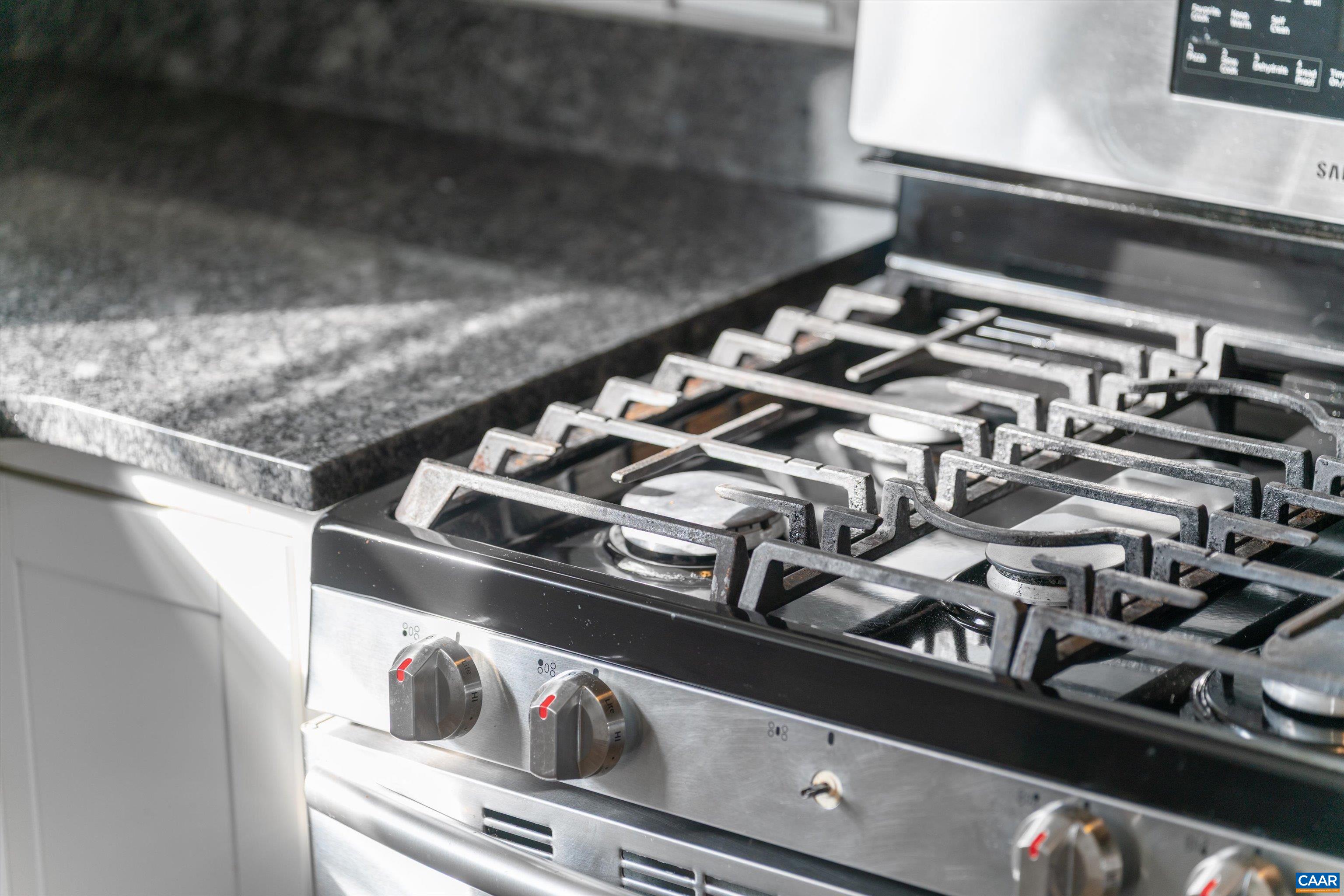 1424 B Street Waynesboro, VA 22980 - Photo 26 of 32 a close up of a stove top oven sitting inside of a kitchen