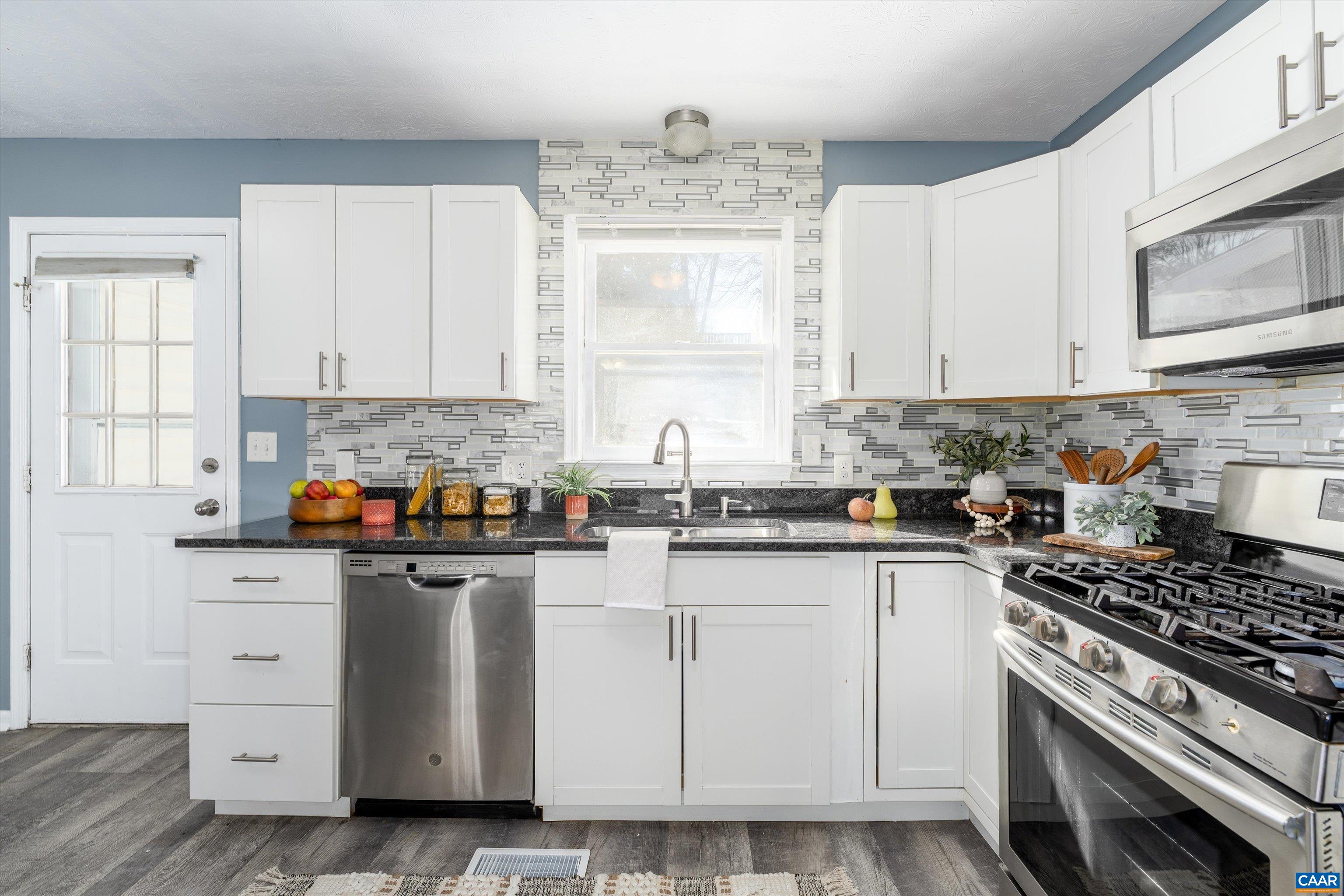 1424 B Street Waynesboro, VA 22980 - Photo 10 of 32 a kitchen with white cabinets and appliances