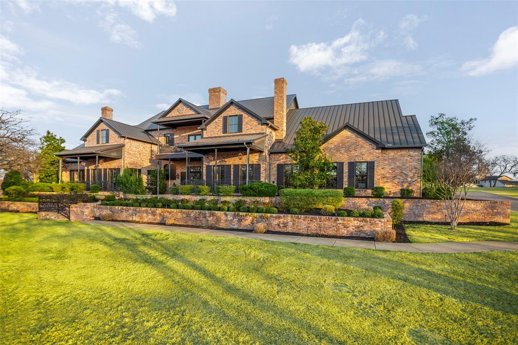 1096 Roadrunner Road Bartonville, TX 76226 - Photo 2 of 40 Cladded in old chicago antique brick and antique reclaimed iron railing mixed in...