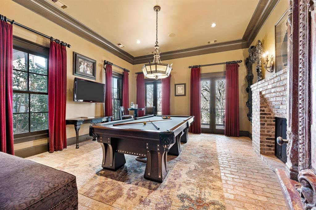 1096 Roadrunner Road Bartonville, TX 76226 - Photo 7 of 40 Billiard room or second study with fireplace with antique chandelier from a catholic school in New Orleans. Door was purchased in Paris fleamarket.