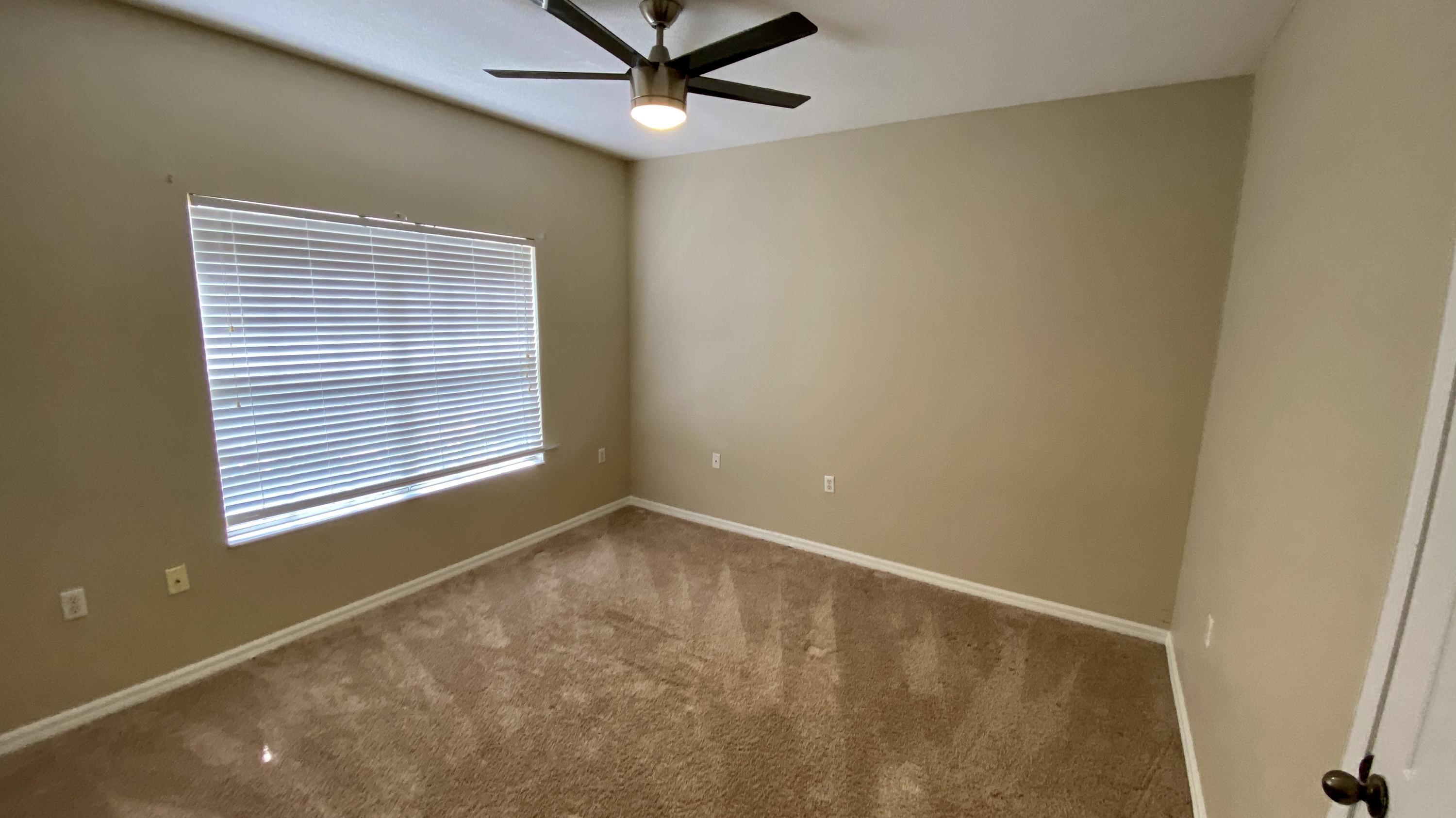 10000 Southwest 52nd Avenue, Unit 76 Gainesville, FL 32608 - Photo 11 of 21 a view of an empty room with a window