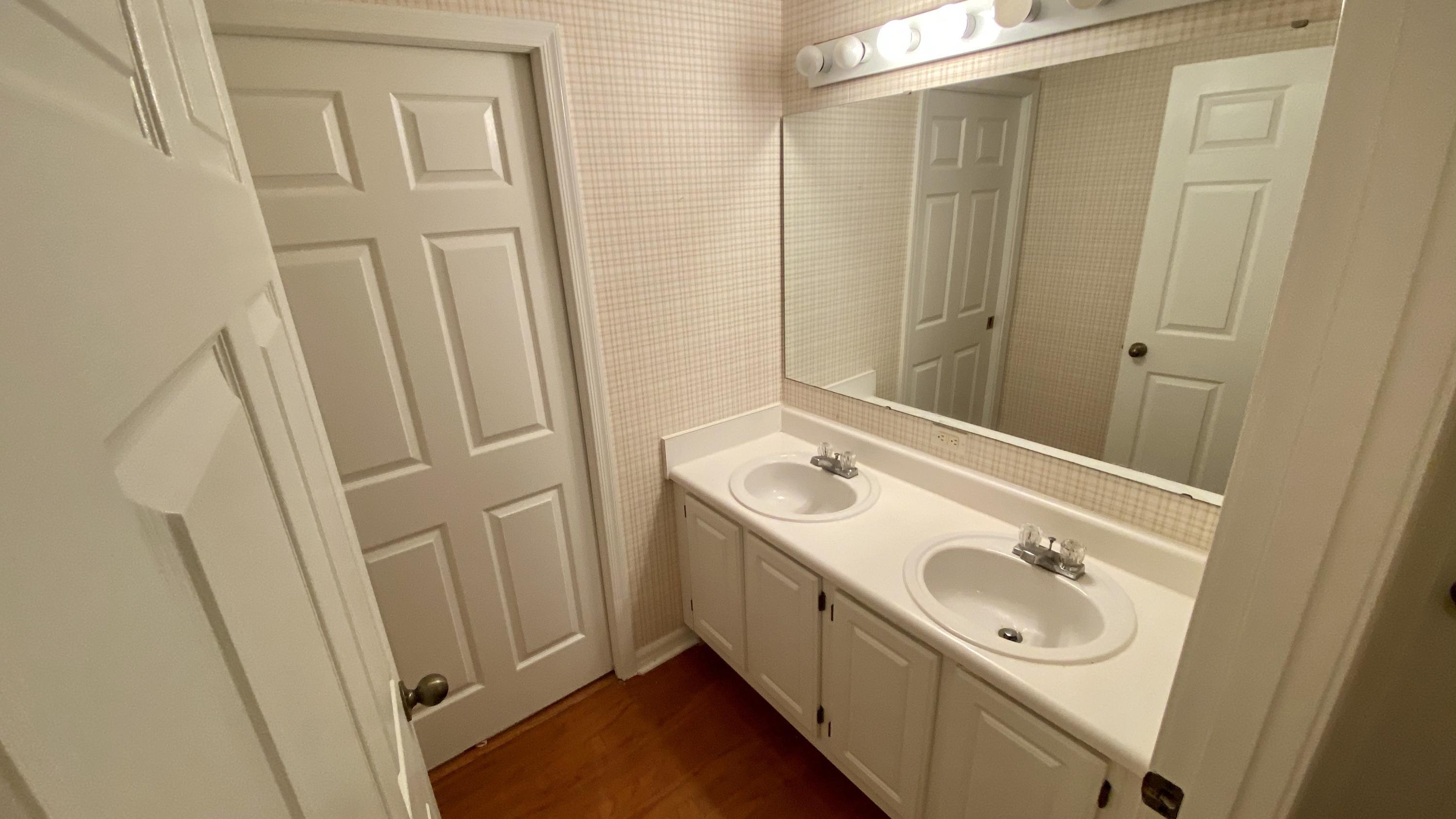 10000 Southwest 52nd Avenue, Unit 76 Gainesville, FL 32608 - Photo 13 of 21 a bathroom with a sink and a mirror