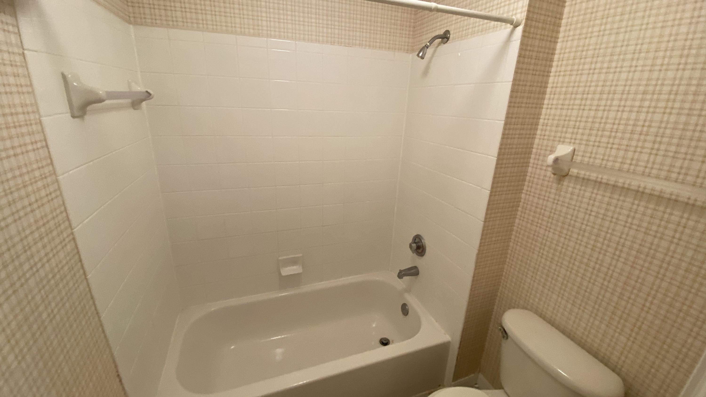 10000 Southwest 52nd Avenue, Unit 76 Gainesville, FL 32608 - Photo 14 of 21 a bathroom with a bathtub and a shower